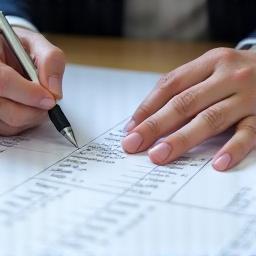 Person sketching a financial plan